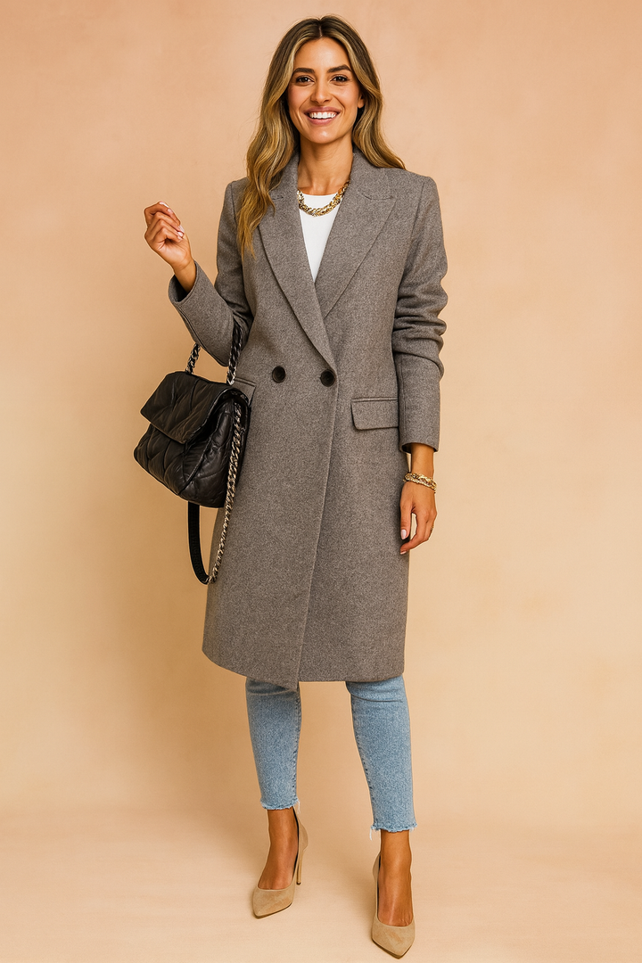 Outerwear essential: a sophisticated women's double-breasted coat in a flattering fit.