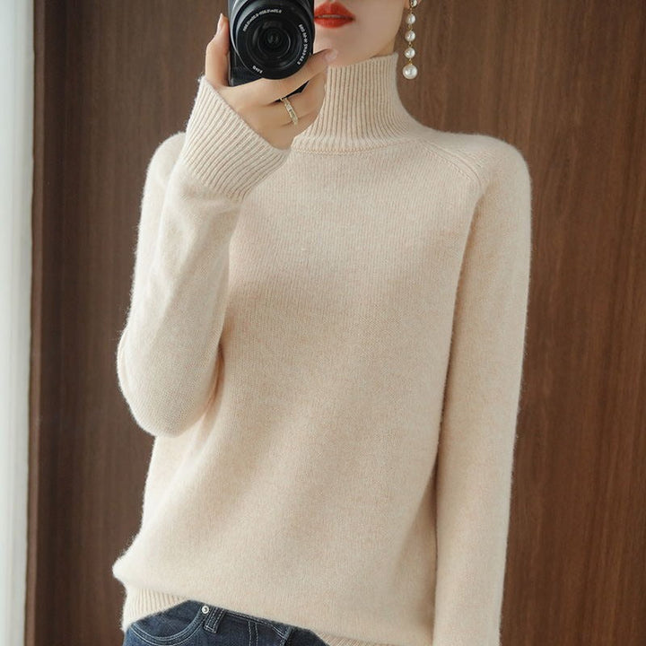 Model wearing a black women's turtleneck sweater, showcasing its classic fit.