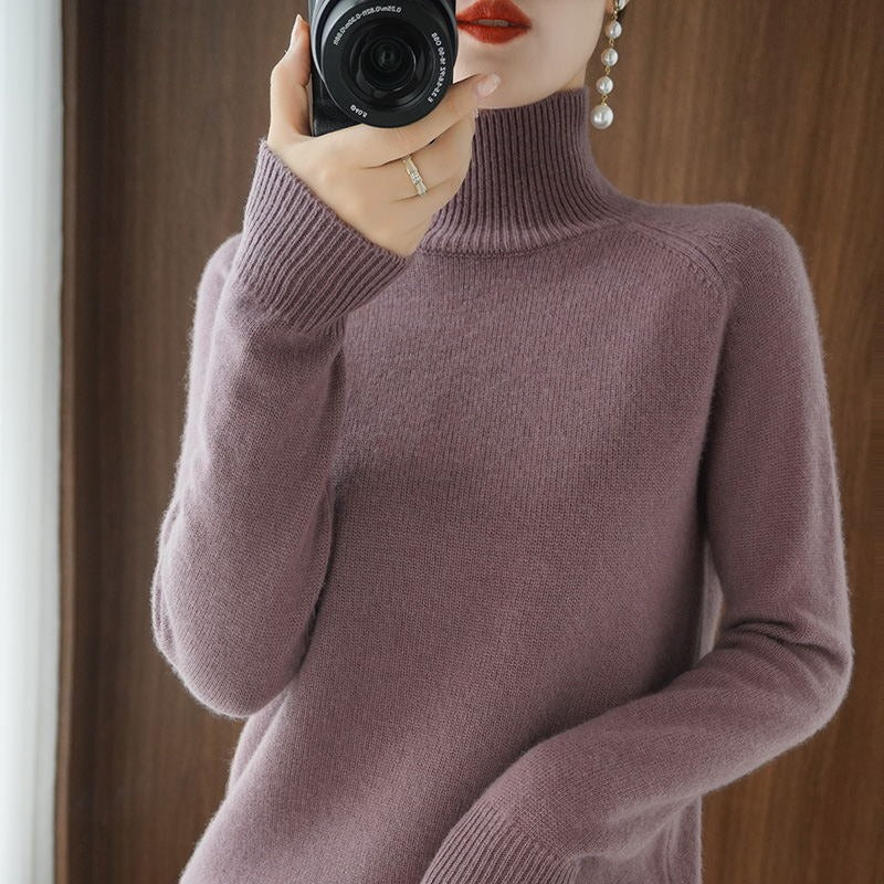 Warm winter fashion: a comfortable women's turtleneck pullover in a rich color.