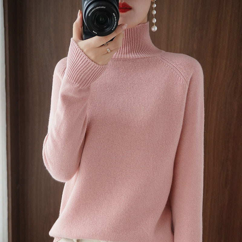 This women's classic fit turtleneck sweater offers versatile styling options.