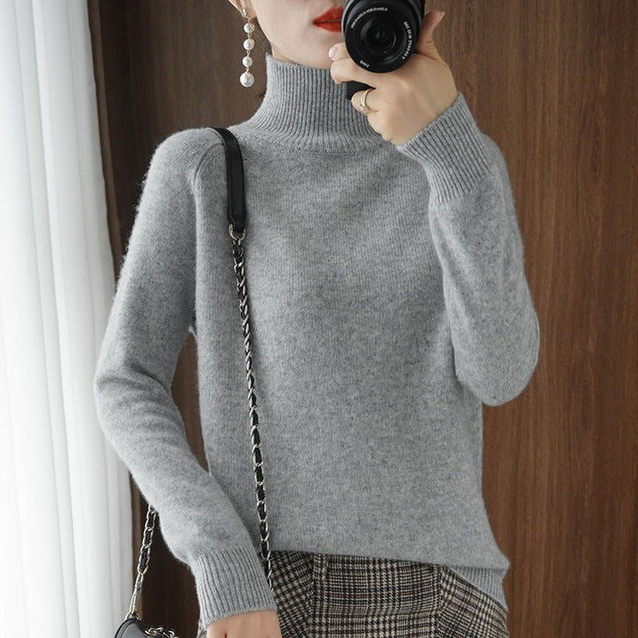 Simple elegance: a women's turtleneck sweater ideal for layering in winter fashion.