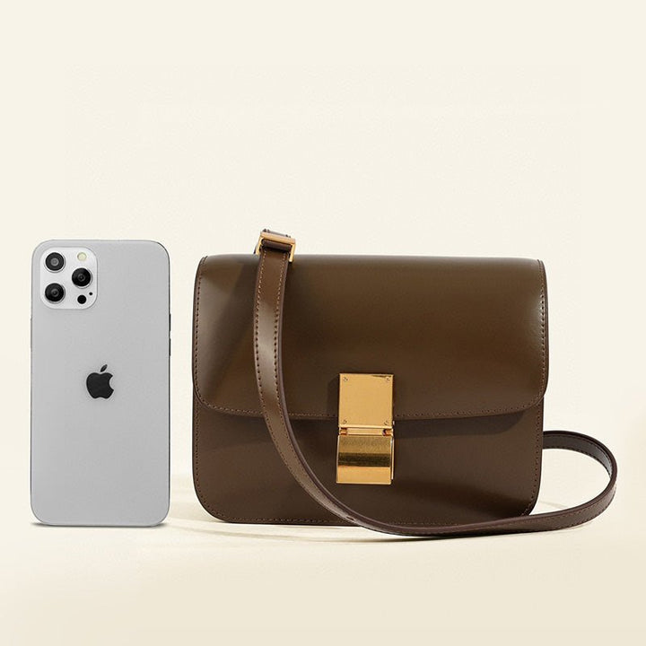 Elegant flap box shoulder bag for women. Perfect timeless fashion accessory with vintage charm.