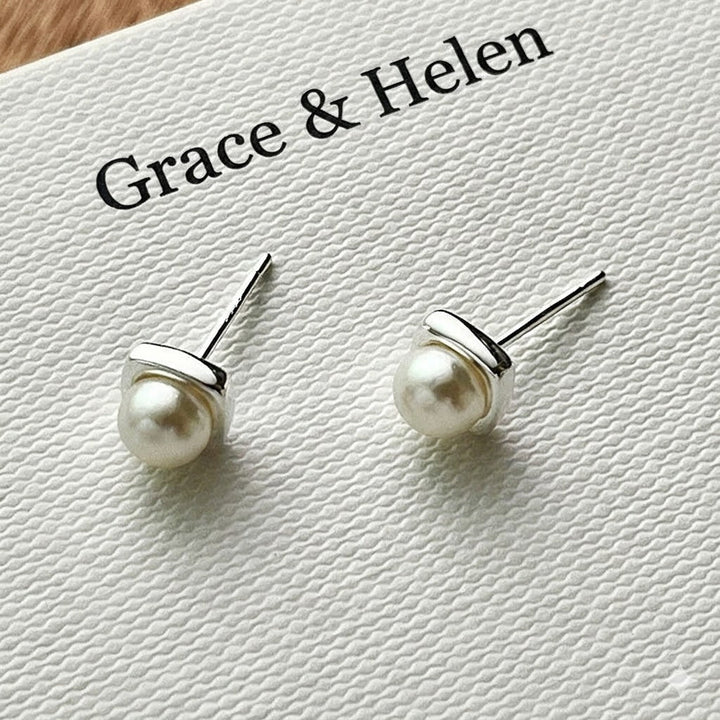Pair of classic women's freshwater pearl drop earrings, adding a touch of elegance to any jewelry collection.