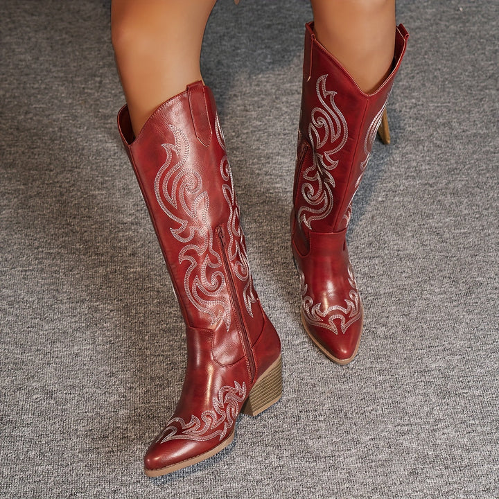 Ankle detail of women's knee-high cowboy boots, showing craftsmanship & classic western design.
