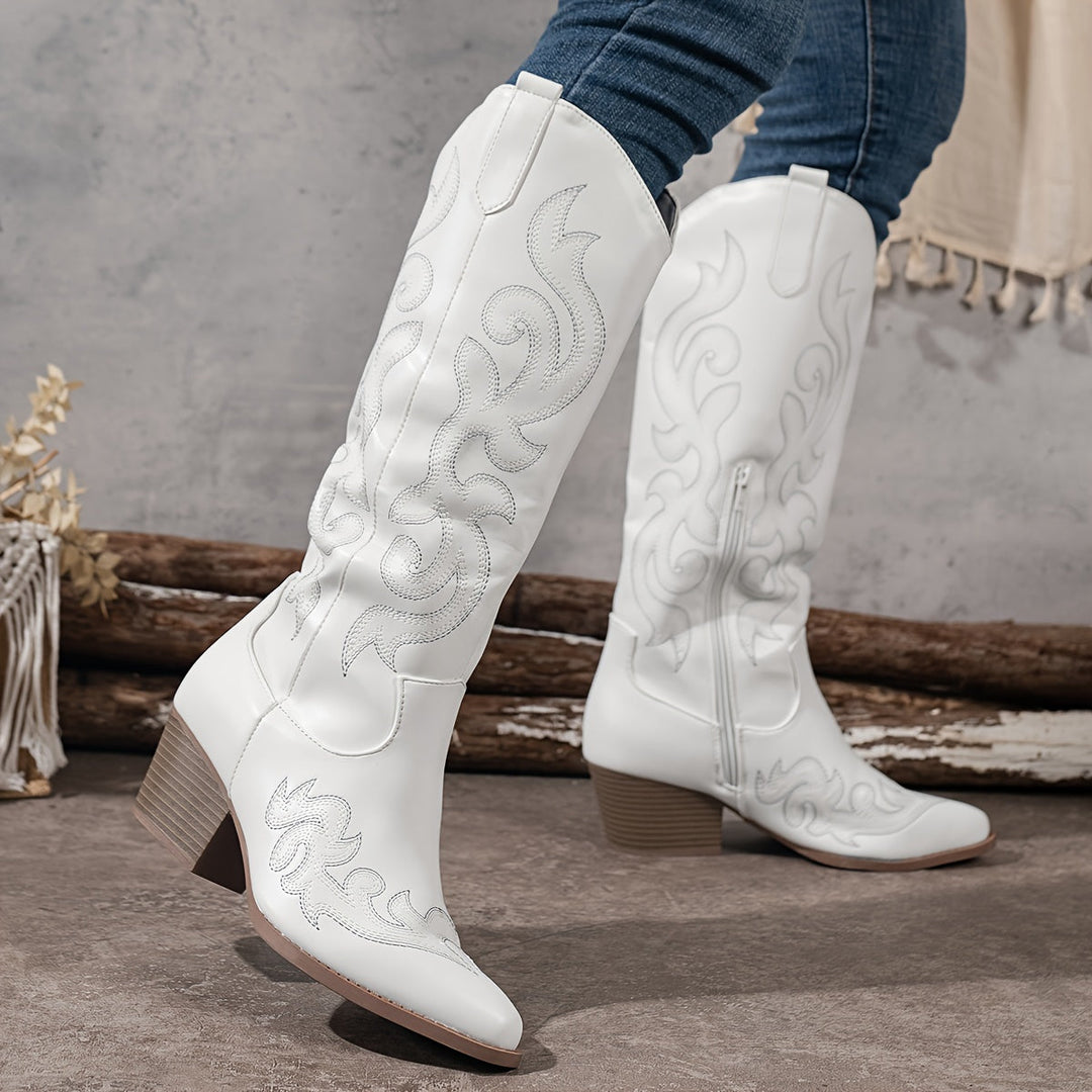 Back view of women's knee-high cowboy boots, showing the classic shaft and sturdy block heel.