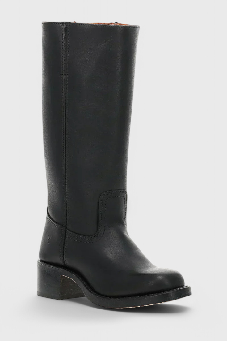 Tall women's knee-high heeled boots. Adding an elegant touch to winter ensembles. Chic design.