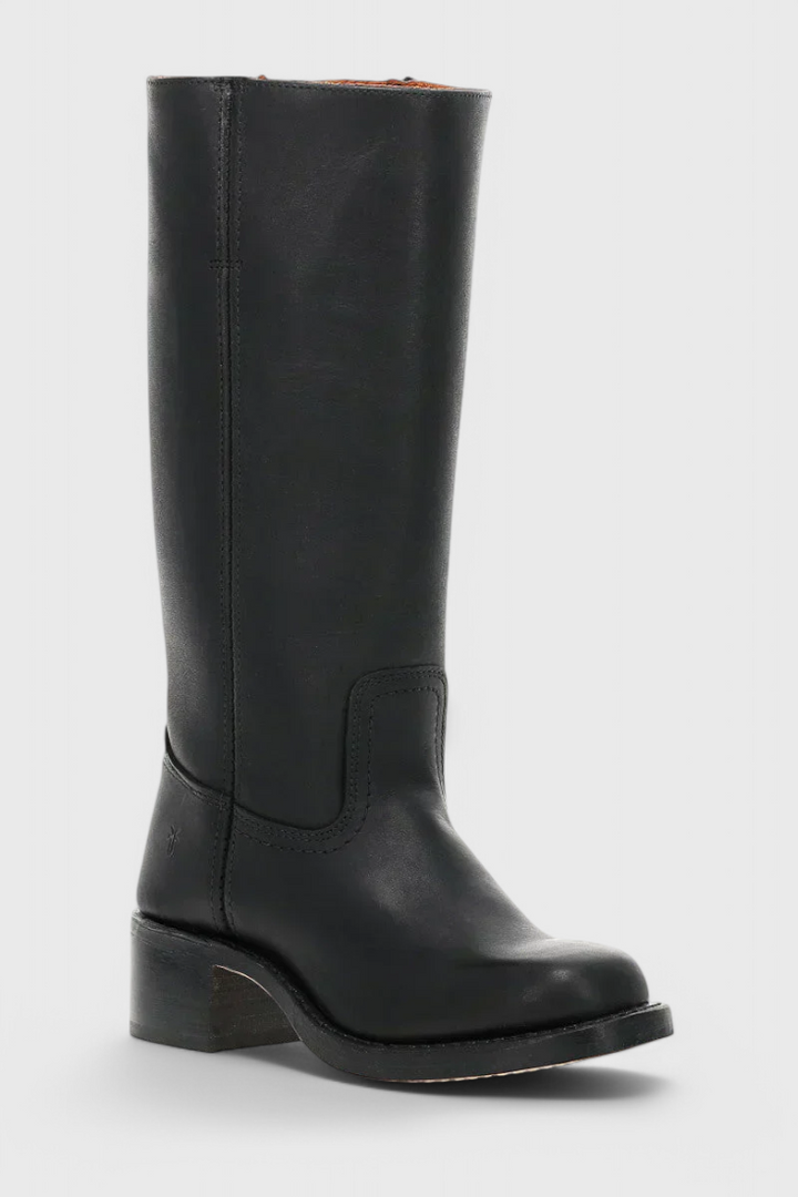 Tall women's knee-high heeled boots. Adding an elegant touch to winter ensembles. Chic design.