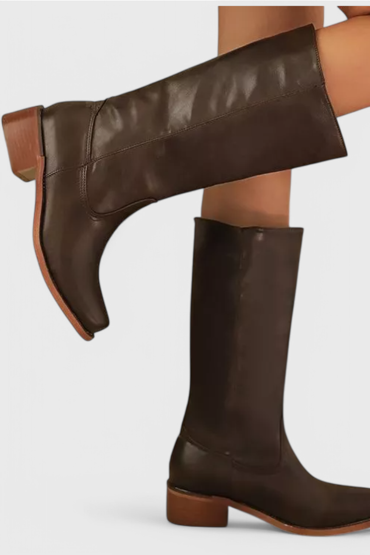 Chic black women's knee-high heeled boots. Classic, comfortable, versatile for any outfit.