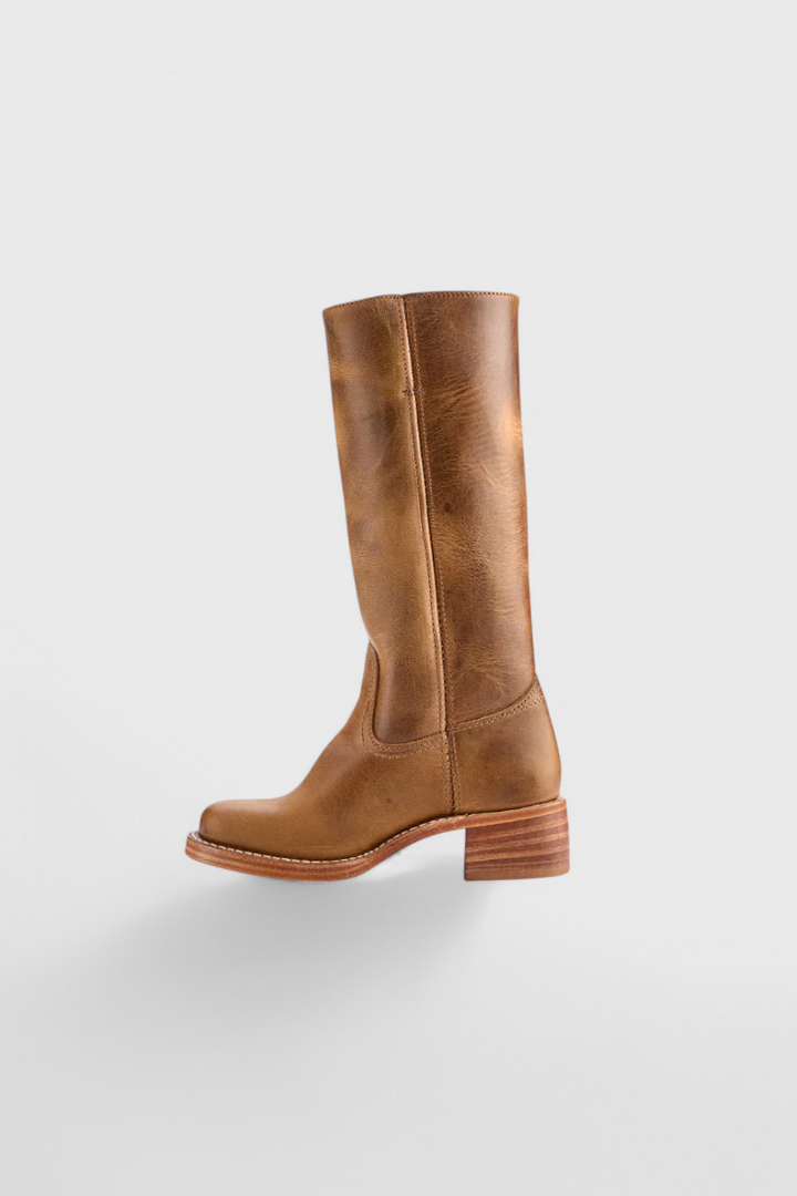 Back view: Women's knee-high heeled boots, showing comfortable heel and elegant fit.