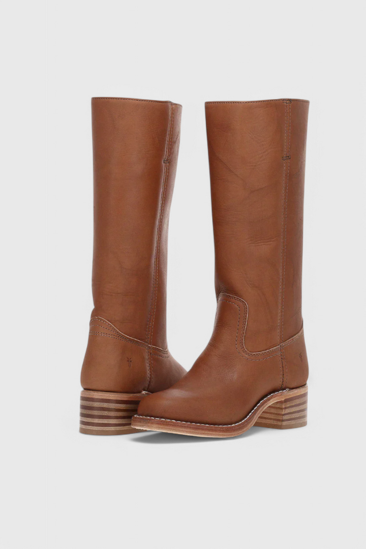 Elegant women's classic knee-high heeled boots with comfortable heel. Perfect for dressy occasions.