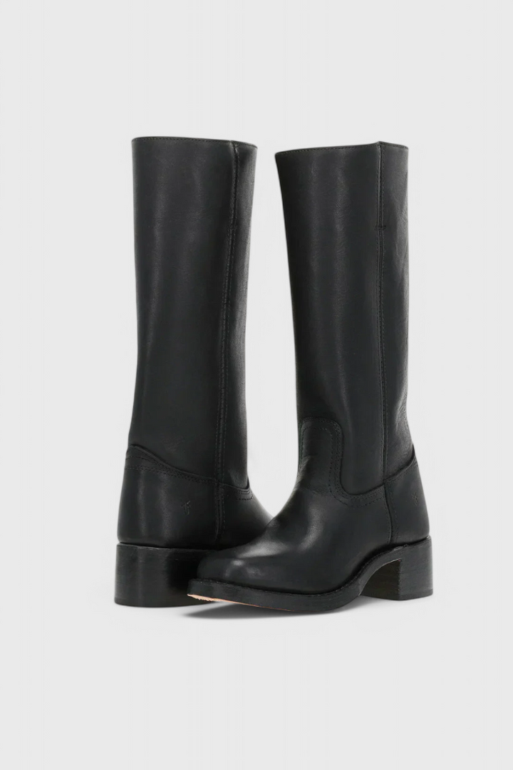 Fashionable women's tall heeled boots. Great for winter outfits, versatile, and stylish footwear.