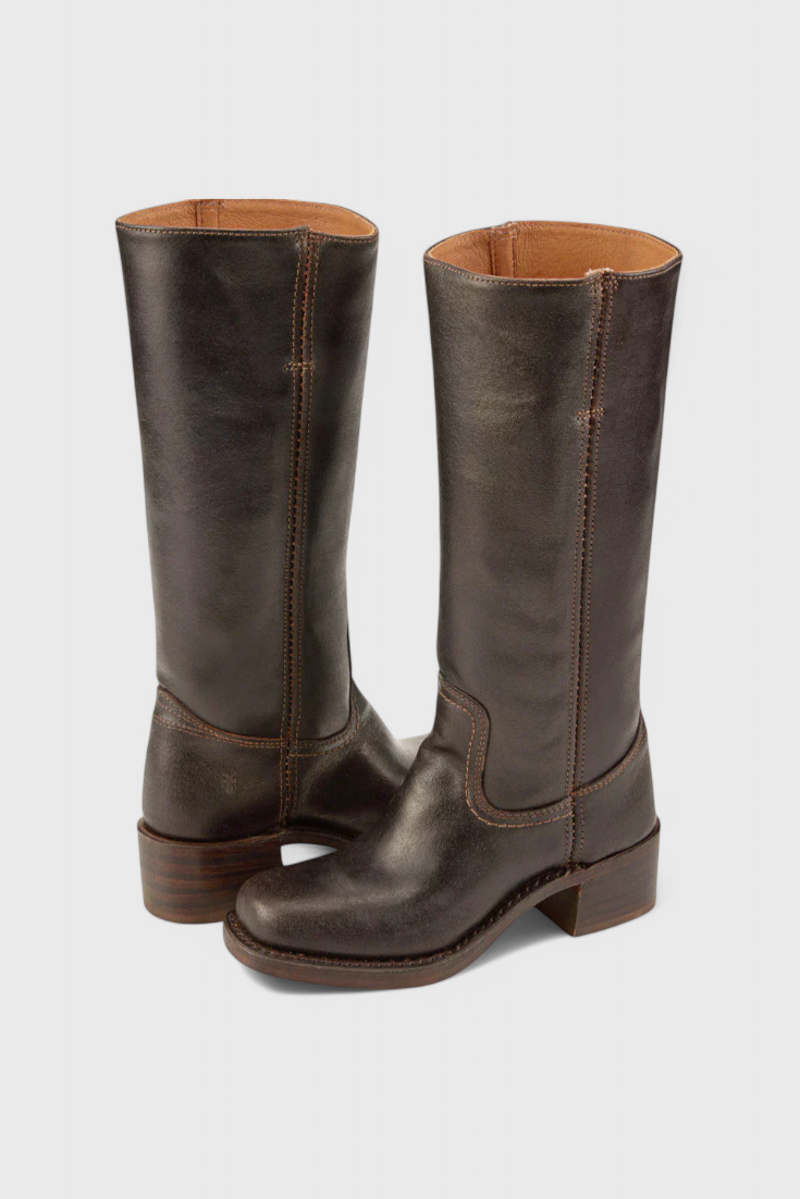 Classic black knee-high heeled boots for women. Elegant, versatile, perfect for winter style.