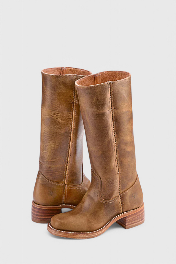 Sleek women's knee-high heeled boots. A timeless classic for sophisticated winter fashion.