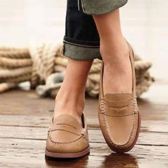 Elegant women's leather slip-on loafers. Chic and comfortable everyday work shoes, perfect for classic casual style.