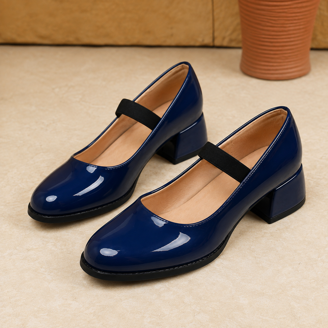 Women's classic low block heel pumps in black, featuring a comfortable round toe design, perfect for office or formal wear.
