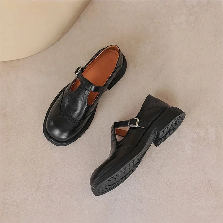 Elegant women's brogue Mary-Jane sandals with a functional buckle strap, ideal for classic casual looks.
