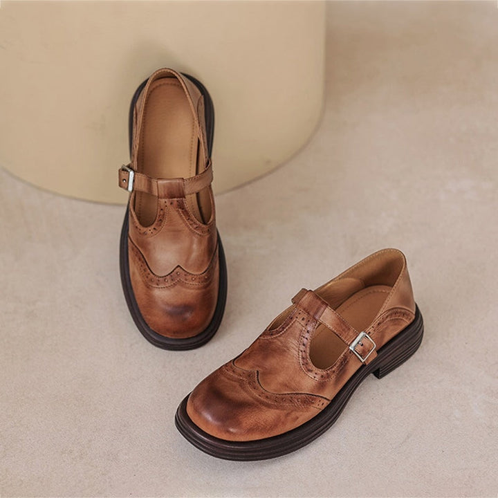 Black women's classic Mary Jane shoes, buckle strap, closed toe, vintage-inspired flat style.