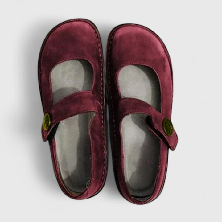 Women's classic Mary Jane footwear, flat and comfortable with a rounded toe, strap, and unique stitch-defined sole.