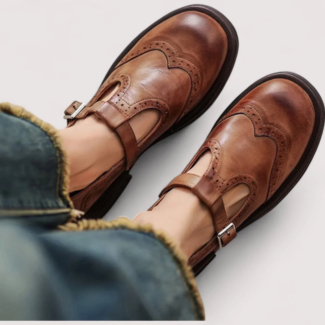 Women's classic Mary Jane shoes with elegant brogue detail, rounded toe & comfortable strap.