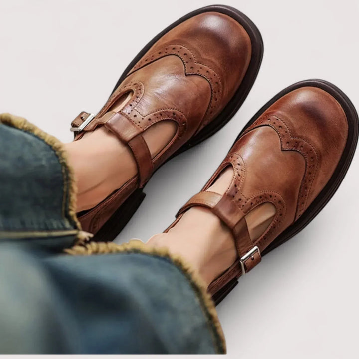 Women's classic Mary Jane shoes with elegant brogue detail, rounded toe & comfortable strap.