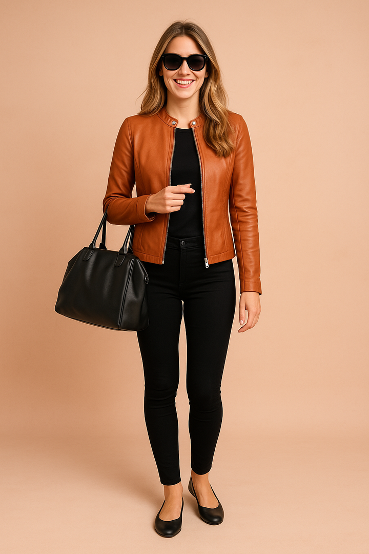 Front view of a stylish women's black minimalist jacket, timeless design.