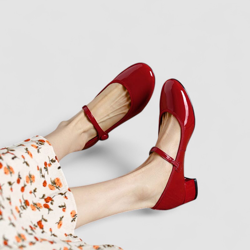 Women's patent leather Mary Jane block heels. Classic style, rounded toe, and comfortable design.