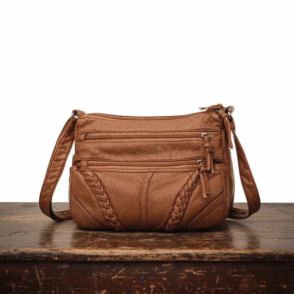 Women's classic retro brown leather crossbody bag with adjustable strap, perfect for everyday style & essentials.