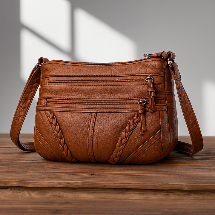 Stylish women's genuine leather crossbody handbag. Vintage design, compact yet spacious for travel or daily use.