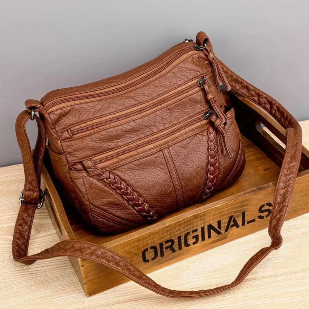 Elegant women's retro brown leather shoulder bag. Versatile for fashion or organized daily essentials.