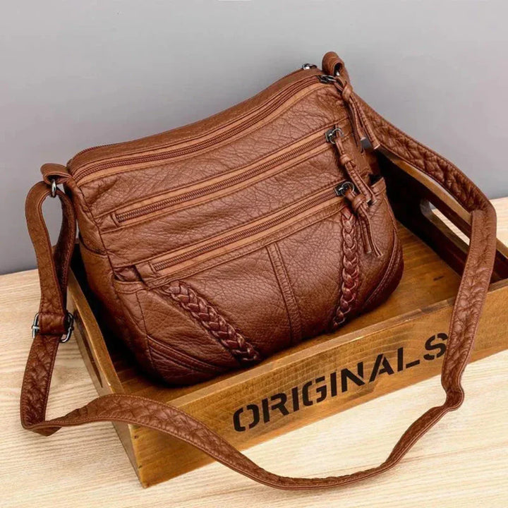Elegant women's retro brown leather shoulder bag. Versatile for fashion or organized daily essentials.