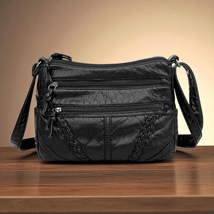 Sophisticated women's retro leather handbag, featuring a comfortable crossbody strap & timeless design.