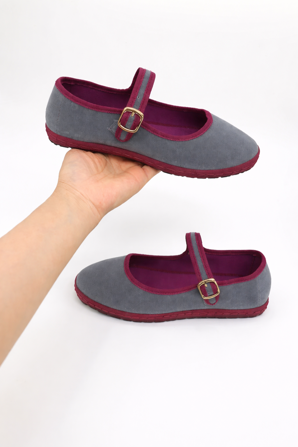 Side view of black women's round toe Mary Jane ballet flats with a sleek buckle strap.