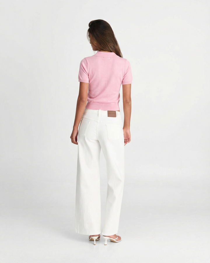 Stylish women's short sleeve polo top, designed with a flattering slim fit for modern minimalist fashion.