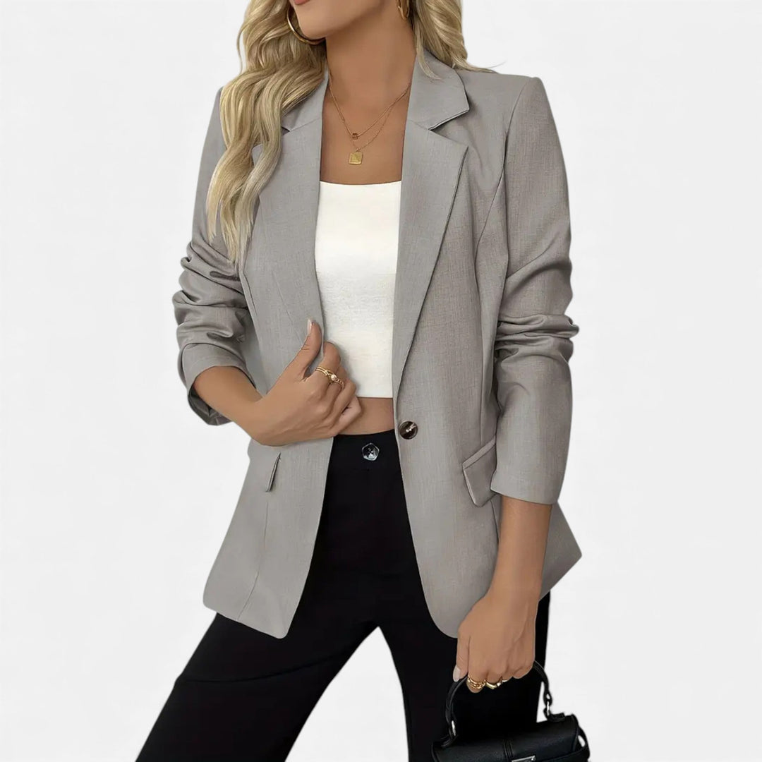 Timeless women's single-breasted blazer, enhancing any outfit from professional to everyday wear.