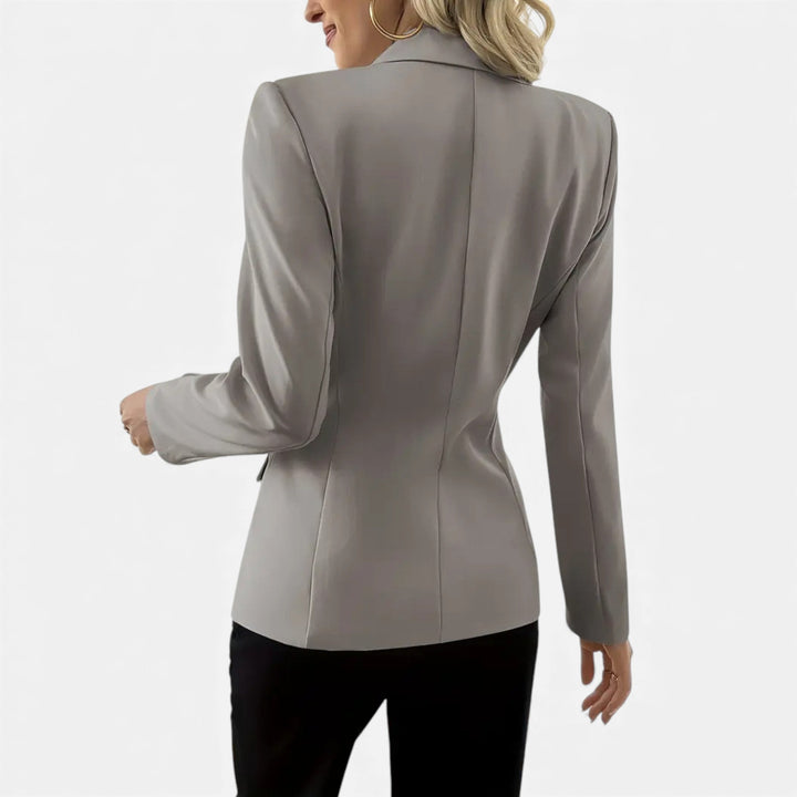 Chic women's classic blazer. An elegant, solid color outerwear piece for versatile styling.