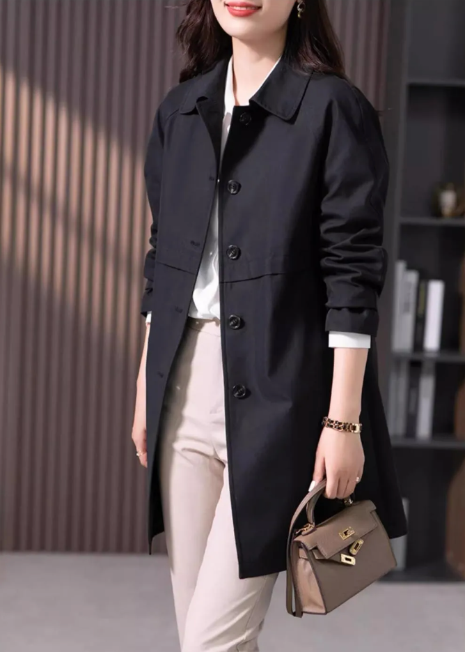 Classic women's single button short black trench coat, a lightweight and elegant outerwear staple for seasons.
