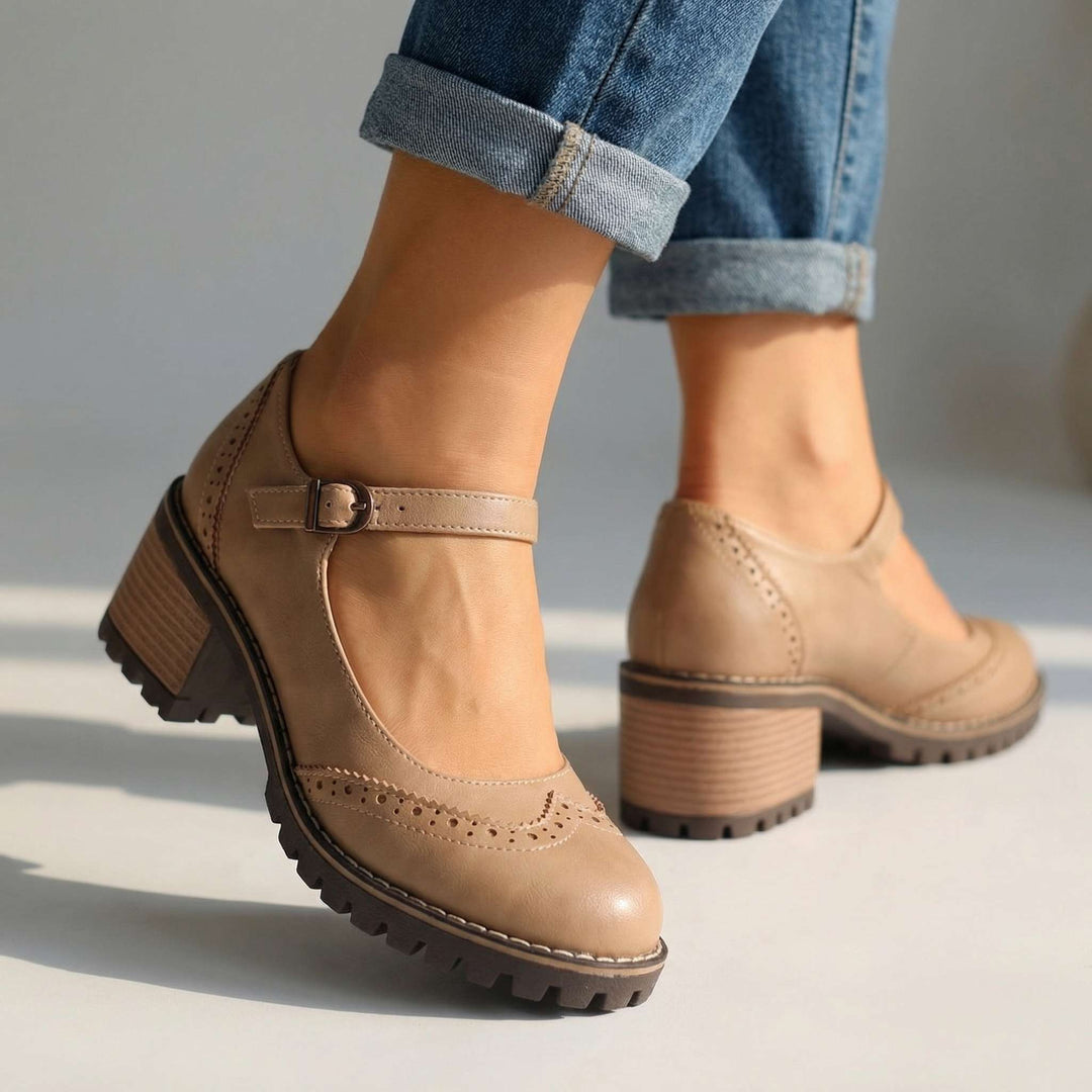 Black T-strap closed-toe block heels for women, ideal comfortable dress shoes for various occasions.