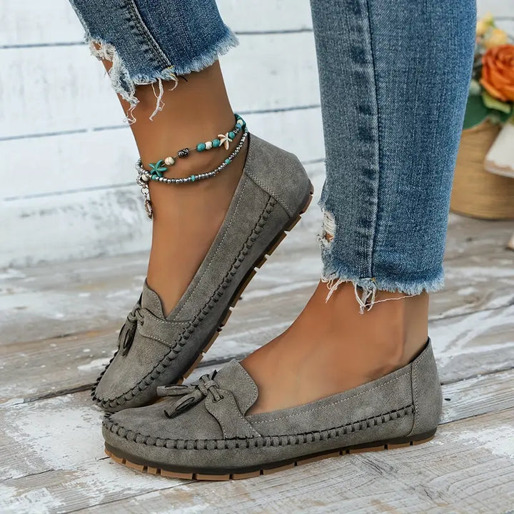 Detail of the durable sole on women's classic tassel loafers, comfortable closed-toe slip-on shoes.