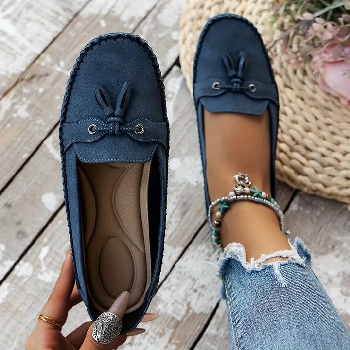 Women's classic footwear: comfortable closed-toe tassel loafers, easy slip-on style for ladies fashion.