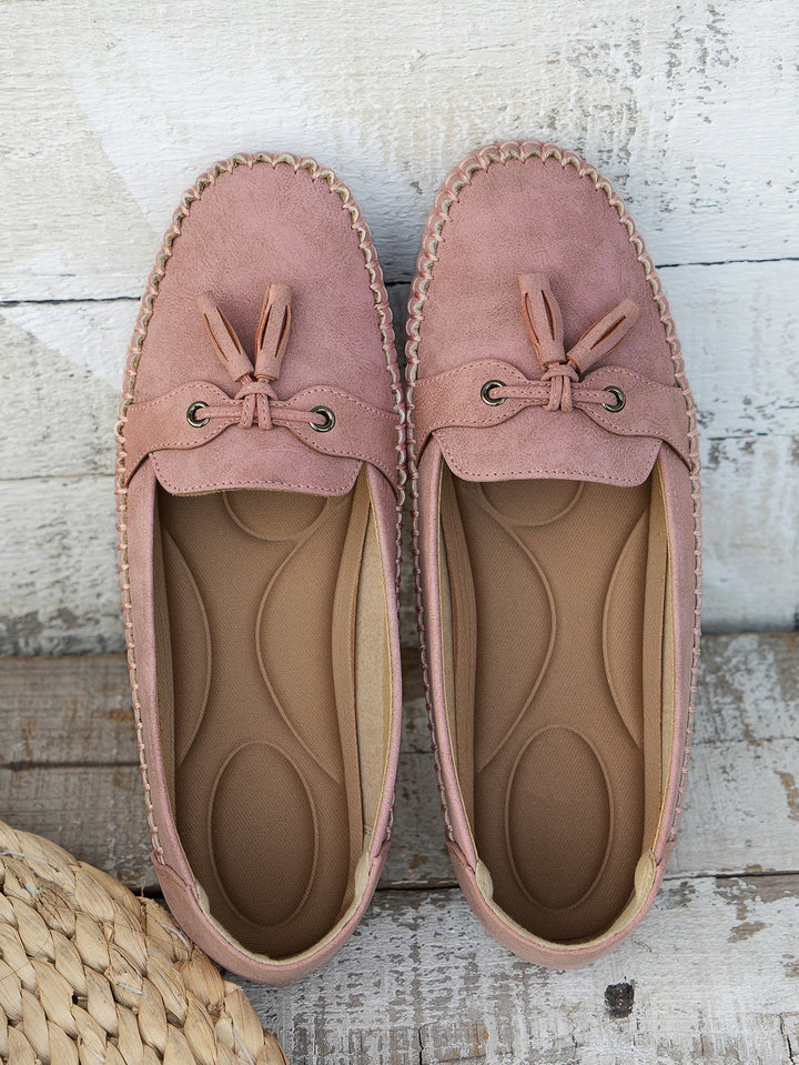 Women's everyday shoes: classic tassel loafers, a comfortable closed-toe slip-on flat for casual chic.