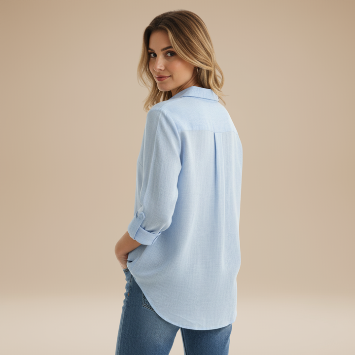 Stylish women's light pink button-up shirt, perfect for versatile styling