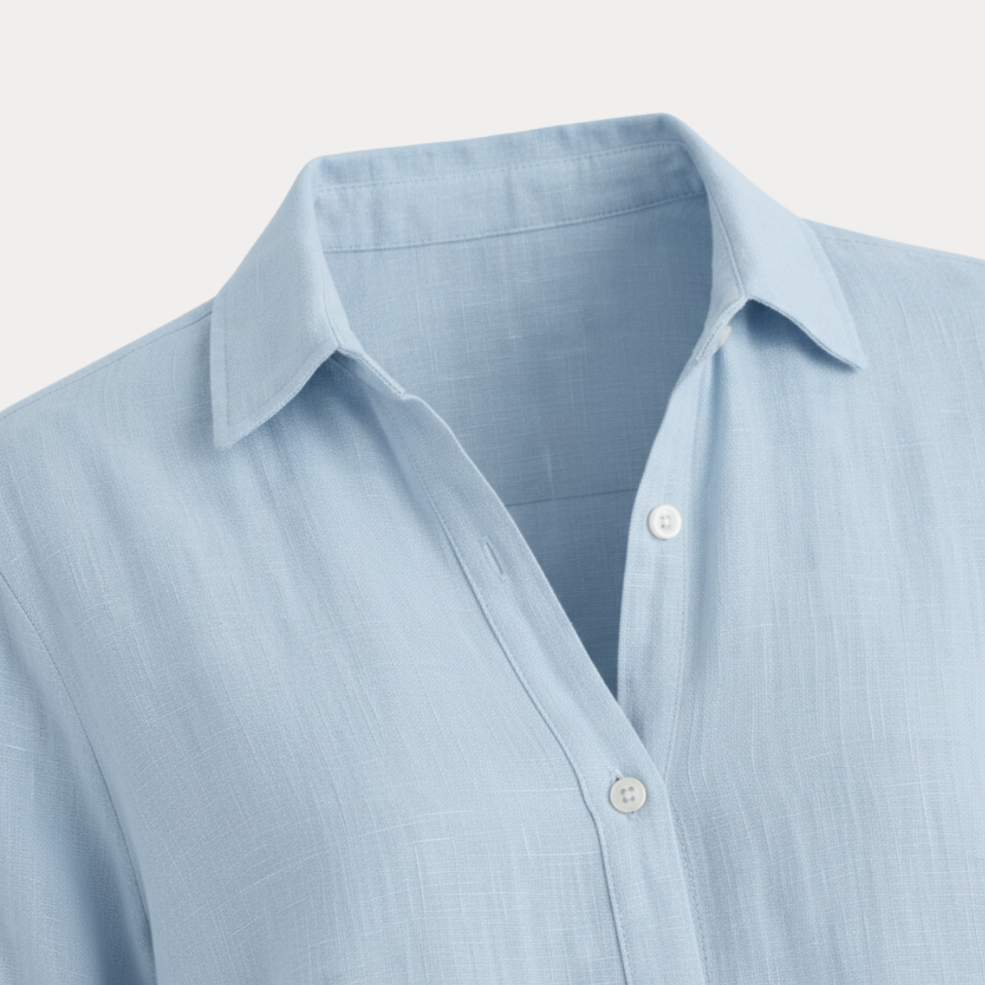 Back view of a women's long-sleeve classic button-up shirt, comfortable fit