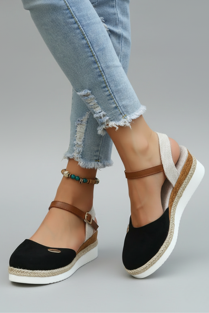 Chic women's closed-toe espadrille sandals, featuring a secure slingback & comfortable sole for summer.