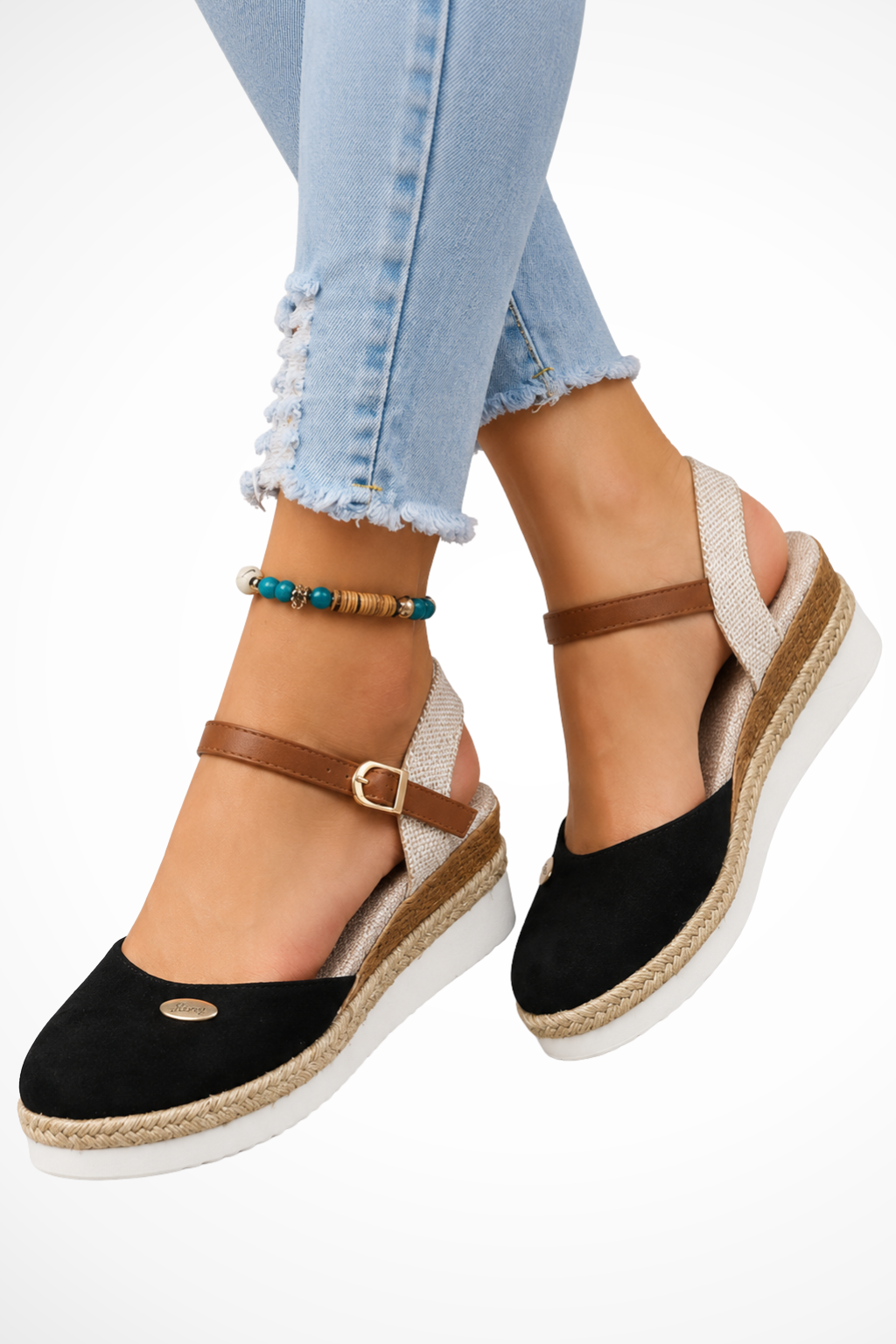 Fashionable closed toe espadrille wedges for women, with a chic ankle strap, offering summer style and comfort.