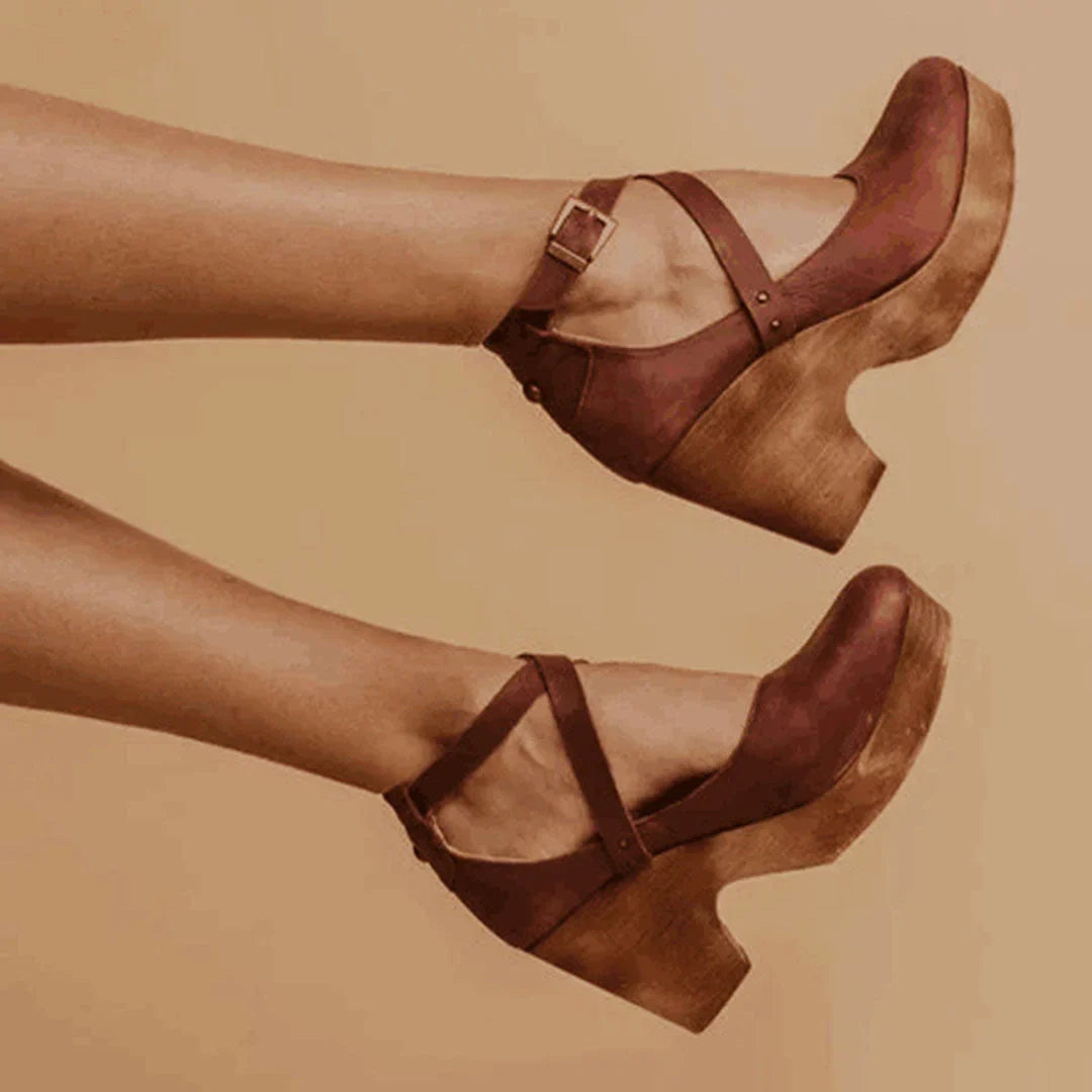 Stylish women's Mary Jane wedge heels with closed toe & ankle strap, offering platform comfort for elegant wear.