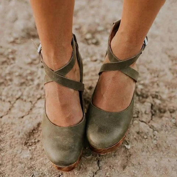 Classic Mary Jane wedge heels for women with closed toe, platform, and ankle strap. Comfortable elegant footwear.