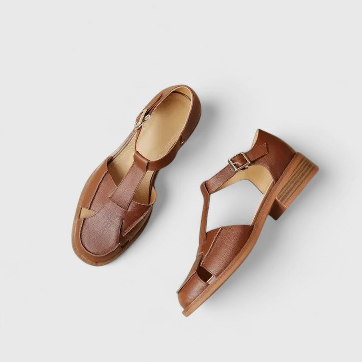 Elegant women's beige closed-toe T-strap sandals, secure adjustable strap & comfortable block heel.
