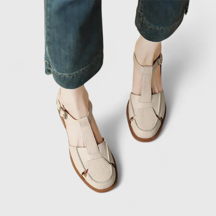 Women's closed-toe T-strap sandals with block heel, offering secure & stylish comfort for daily wear.