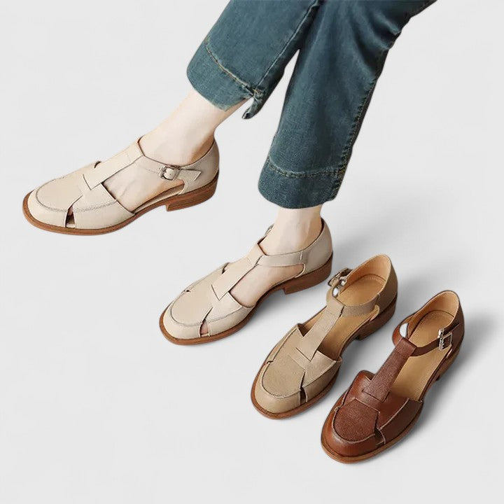 Beige women's closed-toe T-strap sandals, designed for comfortable and elegant summer occasions.