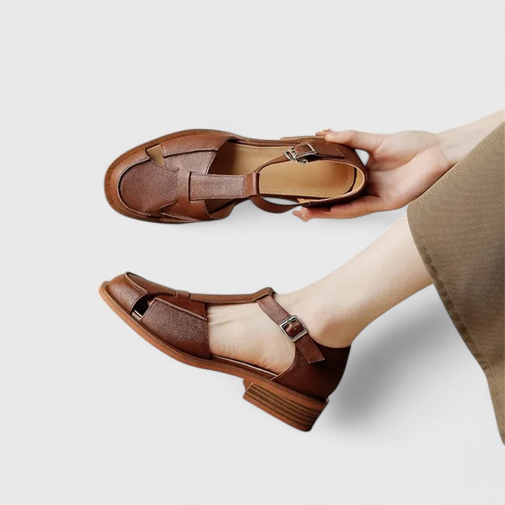 Fashionable women's closed-toe T-strap sandals with block heel, ideal for secure & stylish summer walks.